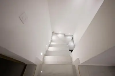 a staircase in a building with white walls at Aries apartment in Belgrade in Belgrade