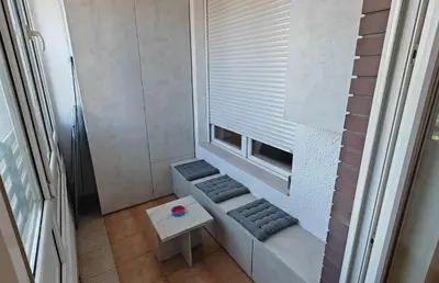 a small room with a bench and a window at Arena Lux apartment in Belgrade