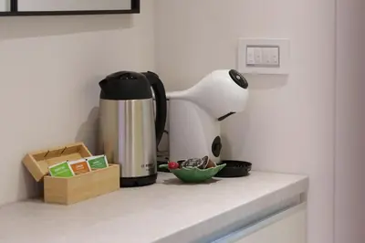 a coffee maker sitting on top of a kitchen counter at Elysian in Belgrade