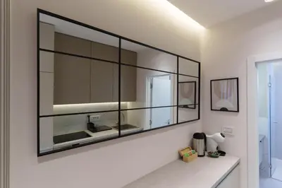 a large mirror on a wall in a bathroom at Elysian in Belgrade