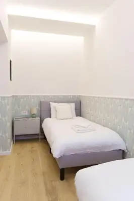 a bedroom with two beds in a room at Elysian in Belgrade