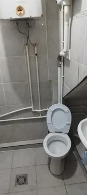 a bathroom with a toilet and a sink at Small apartment with private bathrooms STRONG INTERNET in Belgrade