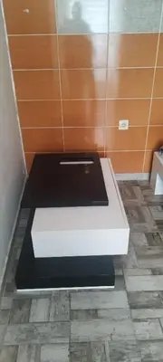 a black and white bench in a room at Small apartment with private bathrooms STRONG INTERNET in Belgrade