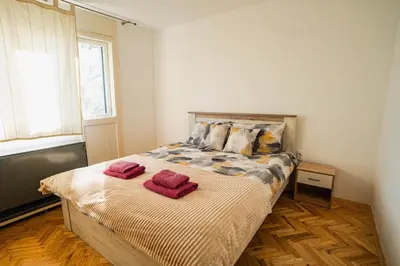 a bedroom with a bed with two towels on it at VP apartment in Belgrade