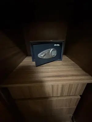 a television sitting on top of a wooden shelf at Hercules Apartment Belgrade Waterfront in Belgrade
