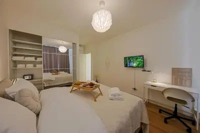 a bedroom with a desk and a bed and a desk at Eternal Lux Belgrade Waterfront in Belgrade