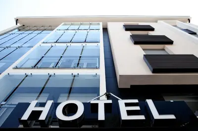 a holt sign is pictured on the facade of a building at Nova City Garni Hotel Signature Collection in Belgrade