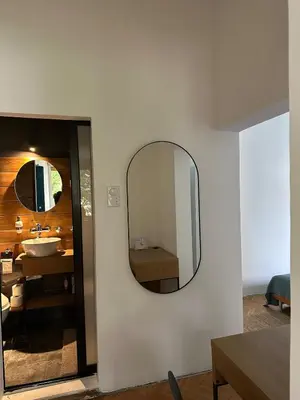 a bathroom with a mirror and a sink at Historic Charm Peaceful and Cozy in Belgrade