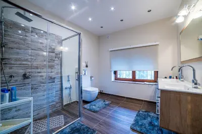 a bathroom with a shower and a sink and a toilet at Alrawda Resort in Mala Ivanča