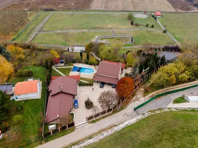 an aerial view of a house with a yard at Alrawda Resort in Mala Ivanča