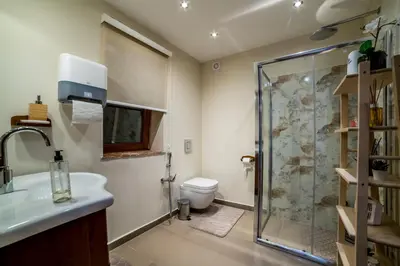 a bathroom with a shower and a sink and a toilet at Alrawda Resort in Mala Ivanča