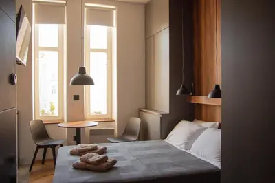 a bedroom with a bed with two towels on it at Riverside Heritage Lux and Modern 3 in Belgrade