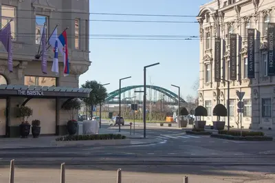 a street in a city with a bridge in the background at Riverside Heritage Lux and Modern 3 in Belgrade