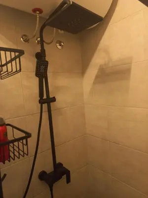 a bathroom with a shower with a shower at Urban Panorama in Belgrade