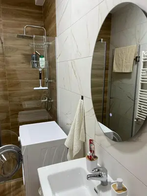 a bathroom with a sink and a mirror at Apartman Relax in Arandjelovac