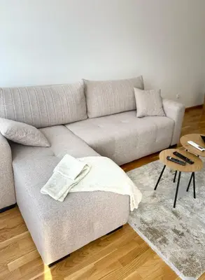 a living room with a couch and a table at Apartman Relax in Arandjelovac