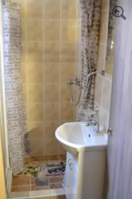 a bathroom with a sink and a shower at Studio Apartman Grof in Belgrade