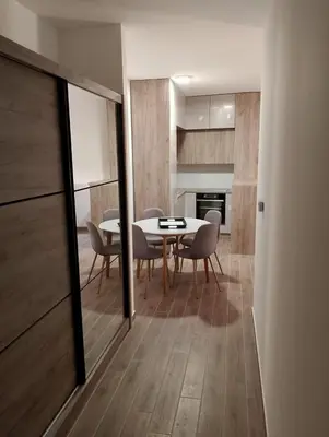 a dining room with a table and chairs at Amare2 in Inđija