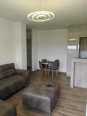 a living room with a couch and a table at Amare2 in Inđija
