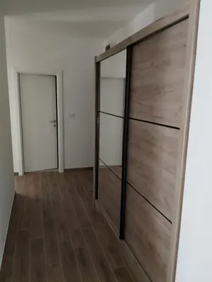 a room with a sliding door with mirrors at Amare2 in Inđija