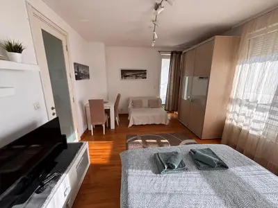 a living room with a couch and a table at Belvil Belgrade in Belgrade