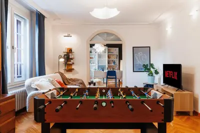 a living room with a foosball table at Sweet Nest 100m2 with Terrace Old Town Renovated in Belgrade