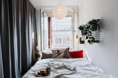 a bedroom with a bed and a large window at Sweet Nest 100m2 with Terrace Old Town Renovated in Belgrade