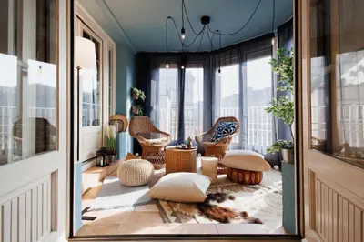 a room with chairs and pillows on a balcony at Sweet Nest 100m2 with Terrace Old Town Renovated in Belgrade