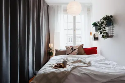 a bedroom with a white bed with a window at Sweet Nest 100m2 with Terrace Old Town Renovated in Belgrade