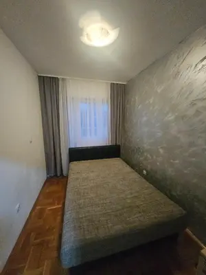 a small room with a bed in the corner at Apartman daba 1 in Belgrade