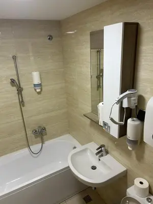 a bathroom with a tub and a sink and a shower at A Blok A12 in Belgrade