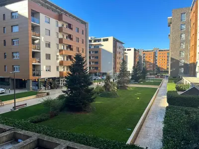 a park in the middle of a city with buildings at A Blok A12 in Belgrade