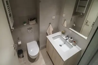 a bathroom with a sink and a toilet at BW Vista studio M&M - free parking in Belgrade