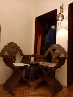 a wooden chair sitting on top of a wooden floor at Mirara in Belgrade