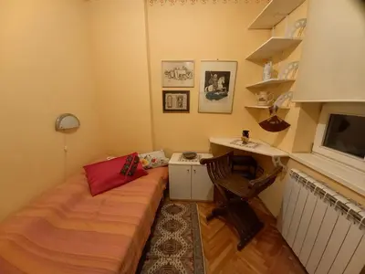 a small room with a bed and a desk at Mirara in Belgrade
