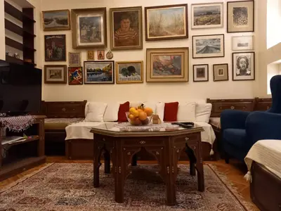 a living room with a table with fruit on it at Mirara in Belgrade