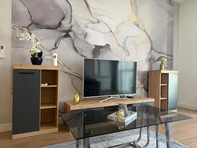 a living room with a tv on a wooden table at ASTRA LUX - Galerija Beograd na vodi - Belgrade Waterfront in Belgrade