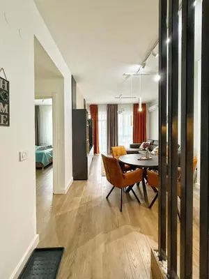 a living room and dining room with a dining table at ASTRA LUX - Galerija Beograd na vodi - Belgrade Waterfront in Belgrade