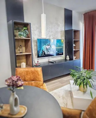 a living room with a flat screen tv on a wall at ASTRA LUX - Galerija Beograd na vodi - Belgrade Waterfront in Belgrade