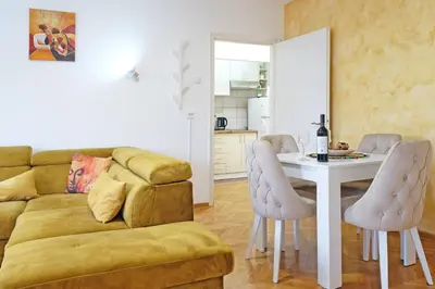 a living room with a couch and a table at Safari Downtown Apartment in Belgrade