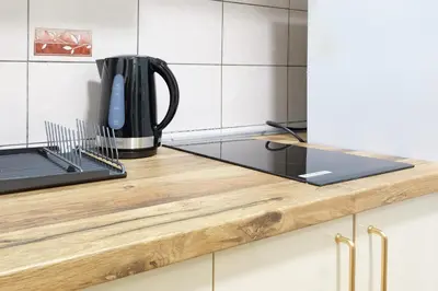 a kitchen counter top with a coffee pot on it at Safari Downtown Apartment in Belgrade