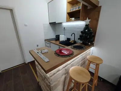 a kitchen with a christmas tree on a counter at Kosmaj Apartmani Košutica - Marija i Ksenija in Koraćica