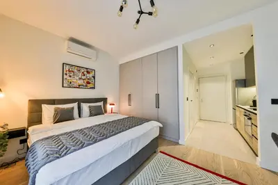 a bedroom with a large bed in a room at ZIGZAG Belgrade Waterfront - SIMFONIJA 1 in Belgrade