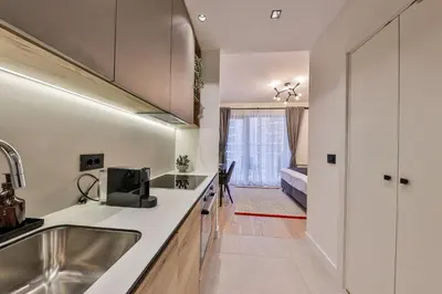 a kitchen with a sink and a counter top at ZIGZAG Belgrade Waterfront - SIMFONIJA 1 in Belgrade