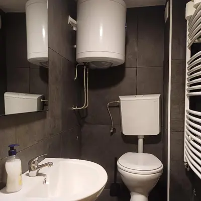 a bathroom with a white toilet and a sink at Lola 2 in Belgrade