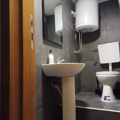 a bathroom with a sink and a toilet at Lola 2 in Belgrade