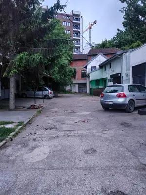 an empty parking lot with cars parked in it at Industrija in Belgrade