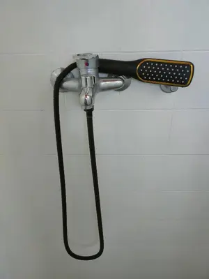 a hair dryer is hanging on a wall at Industrija in Belgrade