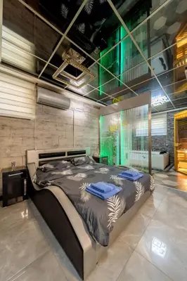 a bedroom with a large bed in a room at Aqualux Apartment with garage in Belgrade