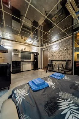 a room with a large bed with blue napkins on it at Aqualux Apartment with garage in Belgrade